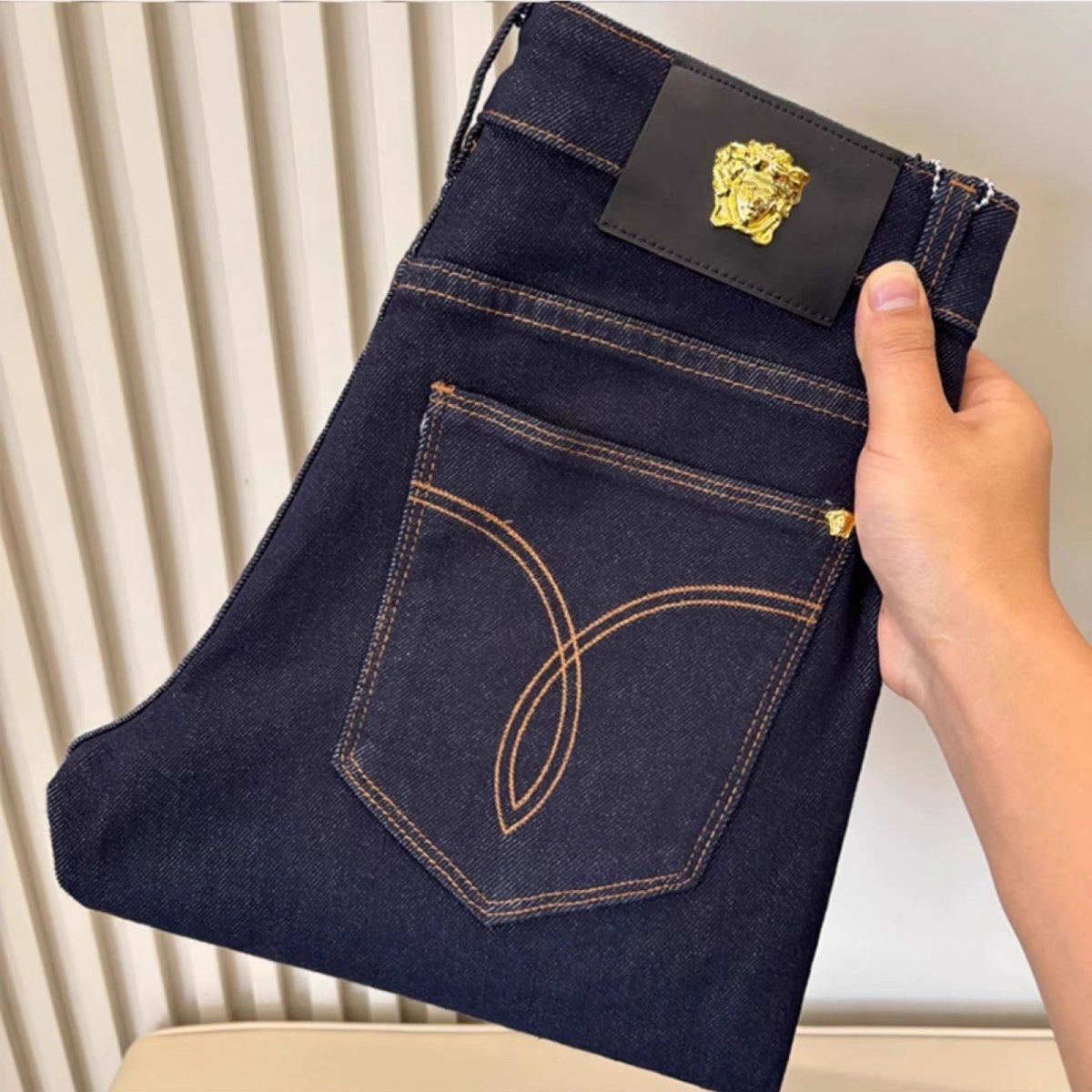 Luxury brand thick men's black jeans, new autumn/winter style, eagle head gold.